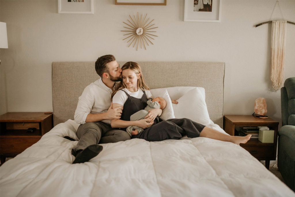 Wichita Newborn Photographer | Family on bed